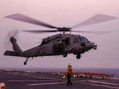 
      
      US Navy search for helicopter crew member in Arabian Sea
      
      