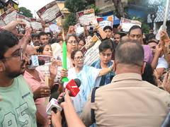 
      
      Mamata Banerjee leads candlelight march over Baruipur Minor's all
      
      