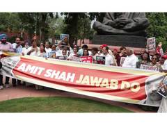 Opposition MPs March to Parliament Against Amit Shah