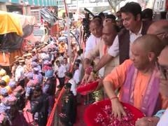 
      
      Uttar Pradesh CM Yogi showers flowers on Kanwariyas in Meerut
      
      