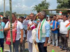 
      
      Nepali Khuti hoists the National Flag amid flood debris
      
      