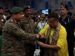 
      
      West Bengal CM ties rakhis to Army soldiers
      
      