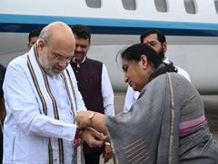 
      
      Amit Shah arrives in Mumbai; Sunetra Pawar ties rakhi
      
      