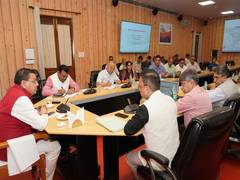 
      
      CM Dhami reviews Madan Mohan's institute's plan at his residence
      
      