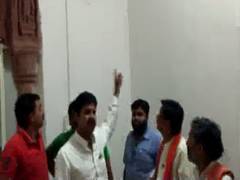 
      
      BJP workers protest over removal of PM Modi's portrait from...
      
      