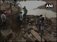 
      
      MP: School children in Umaria struggle to cross river through...
      
      