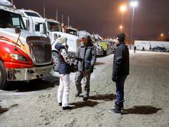 
      
      Canadian court grants injunction to silence trucker protest...
      
      