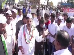 
      
      Congress leader Shivakumar scolds man trying to take selfie...
      
      