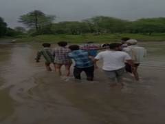 
      
      MP: Locals carry pregnant woman on cot amid heavy rainfall 
      
      