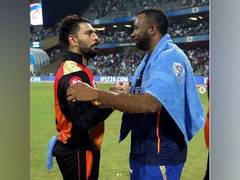 
      
      Yuvraj Singh, Jasprit Bumrah congratulate Pollard 
      
      