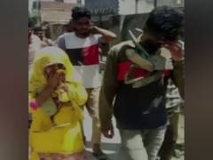 
      
      Man and married woman garlanded with shoes, paraded in...
      
      