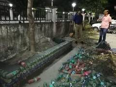 
      
      Model using empty bottles to help understand plastic waste...
      
      