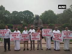 
      
      Delhi: MPs protest against GST on job works
      
      
