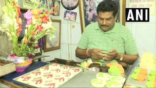 
      
      Howrah: Confectionary serving sweets with party symbols
      
      