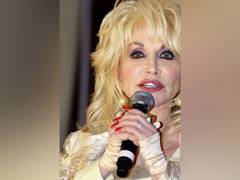 
      
      Here's why Dolly Parton sleeps with makeup on
      
      