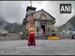 
      
      Priest stands in Sirsasana outside Kedarnath Temple, demands...
      
      