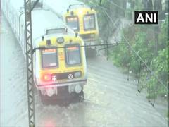 
      
      Mumbai: Halted local trains resume services as waterlogging...
      
      