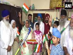 
      
      Tokyo Olympics: Gurjit Kaur's family exchanges sweets in...
      
      