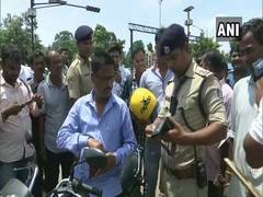 
      
      Police distributes free helmets to traffic violators in...
      
      