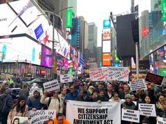 
      
      US: Members of Indian diaspora march at Times Square in...
      
      