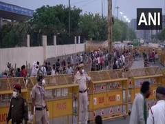 
      
      People at Delhi's Ghazipur market observe social distancing...
      
      