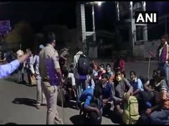 
      
      Migrants walking towards railway station stopped at...
      
      