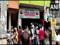 
      
      Large crowd gathers outside liquor shop in Visakhapatnam,...
      
      