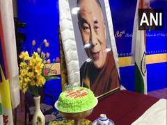 
      
      Members of Tibetan government-in-exile celebrate Dalai Lama's...
      
      