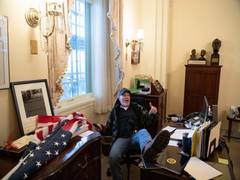 
      
      Man photographed sitting with foot up on Speaker Nancy Pelosi...
      
      