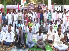 
      
      Congress supporters protest outside guest house where...
      
      