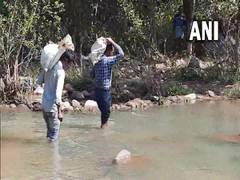 
      
      Teachers in Chhattisgarh village walk 8 km every day carrying...
      
      