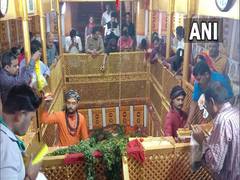 
      
      UP: Devotees offer prayers at Lete Hanuman Mandir on the...
      
      