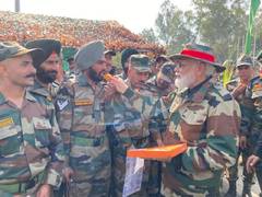 
      
      PM Modi distributes sweets to soldiers in J-K's Nowshera on Diwali
      
      