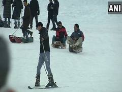 
      
      Tourists enjoy snowfall at Gulmarg, steady business for...
      
      