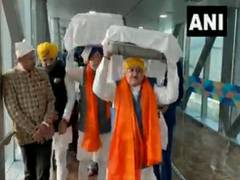 
      
      Hardeep Puri, BJP Chief Nadda carry Guru Granth Sahib brought...
      
      