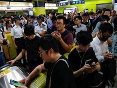 
      
      Chaos in Hong Kong as protesters disrupt metro services
      
      
