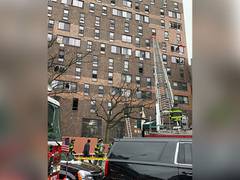 
      
      Nine children among 19 dead in massive fire at New York building
      
      