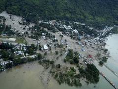 
      
      Flash floods, mudslides kill 63 in Indonesia
      
      