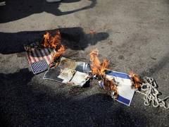 
      
      Protesters burn American flags, Trump pictures outside US...
      
      
