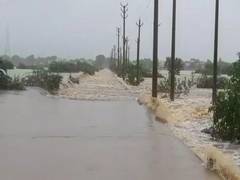 
      
      Munneru stream flows over bridge in Krishna's Vatsavai mandal
      
      