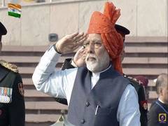 
    PM Modi opts for bright saffron turban for 71st Republic Day celebrations
    