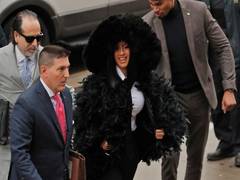 
      
      Cardi B makes dramatic court entry in large feather court
      
      
