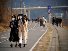 
      
      Women in China undertake anti-coronavirus drive on Int'l...
      
      