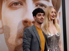 
      
      Pregnant Sophie Turner heads out for stroll with husband, parents
      
      