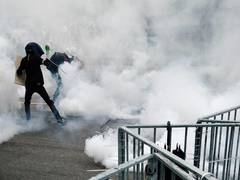 
      
       Hong Kong: Riot police fires tear gas, swung batons at protestors
      
      