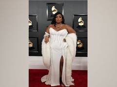 
      
      Lizzo channels 'Roll model' avatar in red bikini during...
      
      