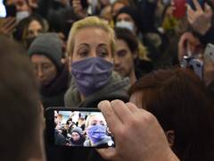 
      
      Kremlin critic Alexey Navalny's wife detained during protest...
      
      