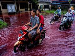 
      
      Waters in Indonesian village turn red as floods hit...
      
      