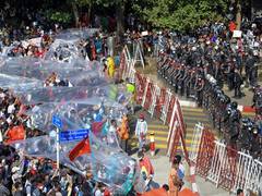 
      
      Over 100 arrested as Myanmar police begin crackdown on protesters
      
      