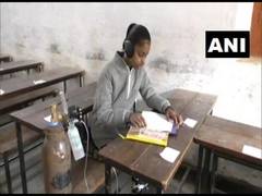 
      
      Suffering from lung disease, girl carries oxygen cylinder to...
      
      